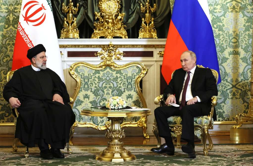 Putin and Iranian President seated together at the Kremlin during bilateral talks