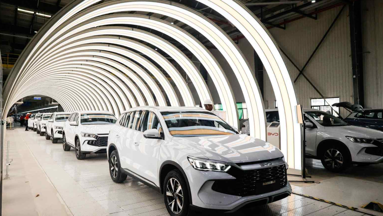 BYD vehicles rolling off the assembly line at an overseas production facility