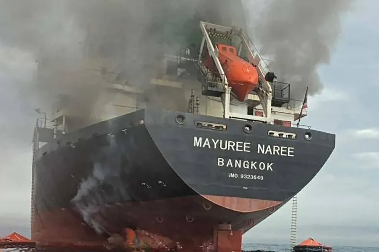Smoke rises from the Thai bulk carrier Mayuree Naree near the Strait of Hormuz after an attack on March 11
