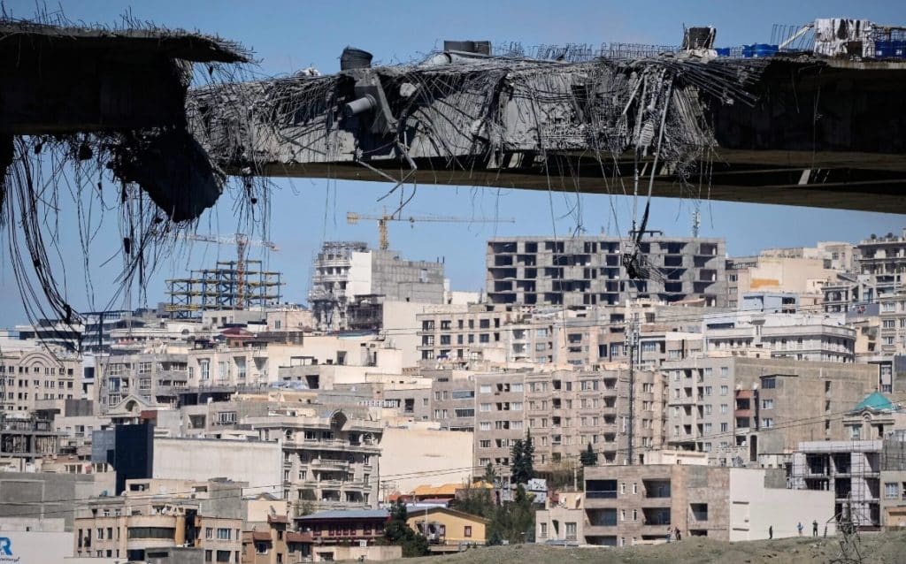 A bridge struck by US airstrikes is seen in the town of Karaj