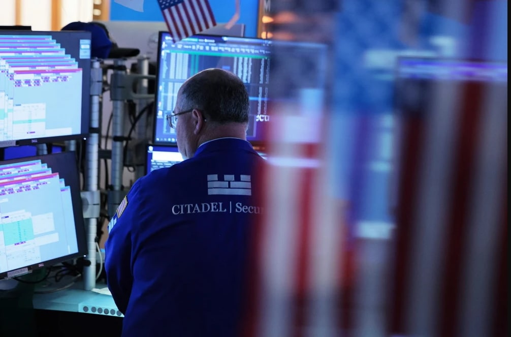 Traders work on the floor of the New York Stock Exchange on Monday