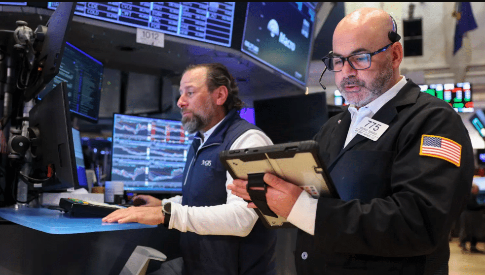 NYSE traders on the floor monitoring market moves in real time as Iran war headlines break