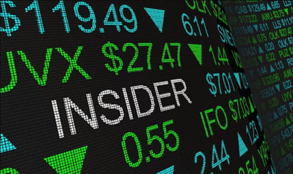 Stock market ticker board displaying "INSIDER"