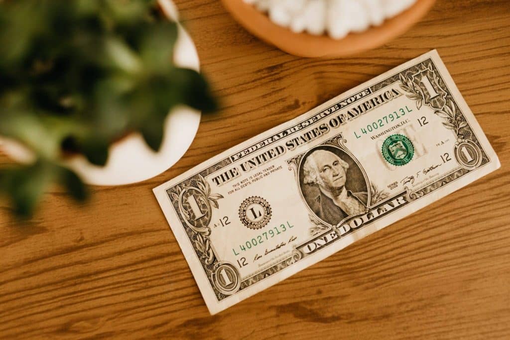 1 dollar bill on a table