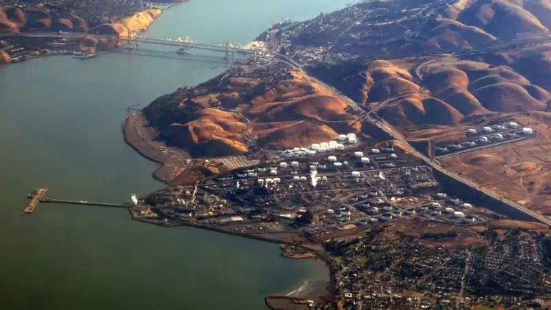 Aerial view of coastal oil refinery and storage tank complex Strait of Hormuz
