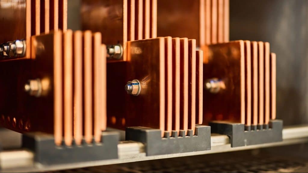 Copper busbars used in industrial power infrastructure, the kind deployed in data center and grid applications