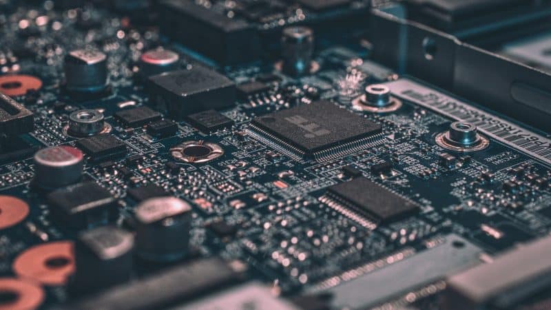 Semiconductor stocks image showing AI chips and circuit board, highlighting AI stock selloff, defensive stocks rally, AI bubble, and AI infrastructure concerns.