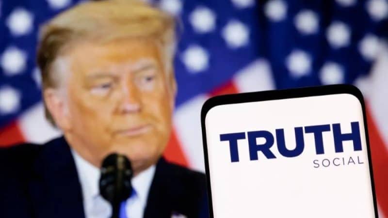 Donald Trump with Truth Social amid Trump Media Q2 loss, Trump Media earnings, Truth Social revenue, Truth Social customers, and Trump Media stock outlook.