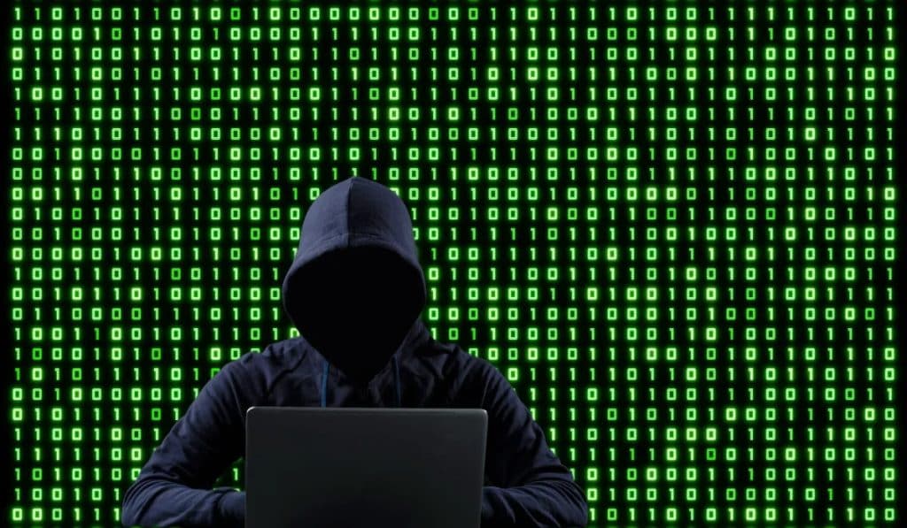 Hacker demonstrating an XRP Bridge exploit on the Coreum bridge, with XRP whales wallets, XRP large holders, and XRP price recovery in focus.