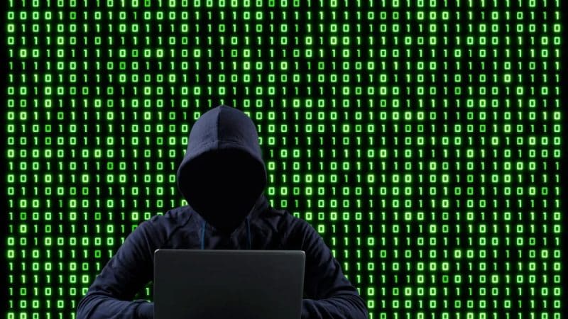 Hacker demonstrating an XRP Bridge exploit on the Coreum bridge, with XRP whales wallets, XRP large holders, and XRP price recovery in focus.